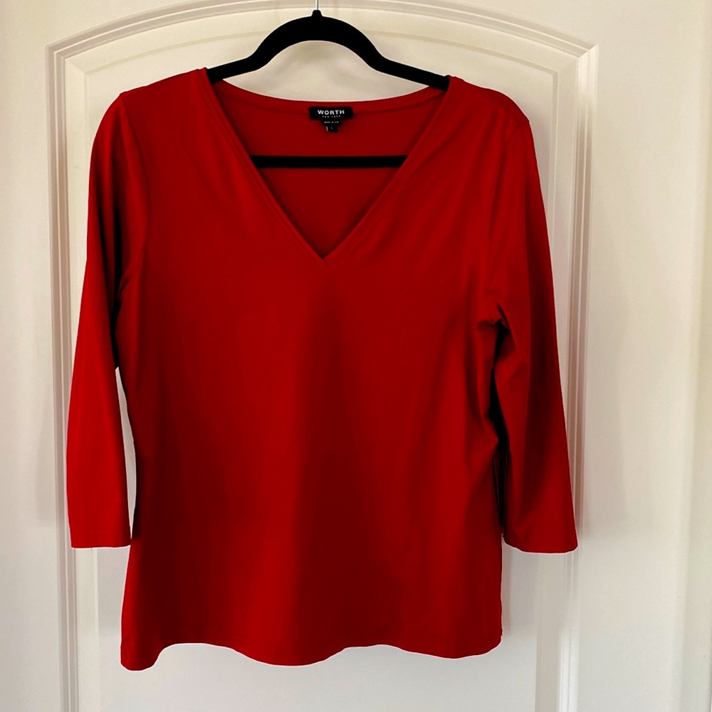 Worth three quarter sleeve V-neck is nylon and elastic